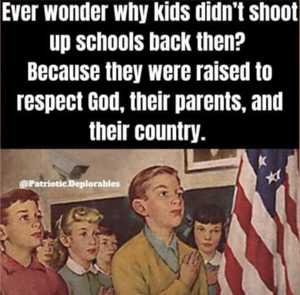 children in class room with an american flag standing upright depicting righteousness exalts a nation when kids are taught to honor God, respect parents and teachers.