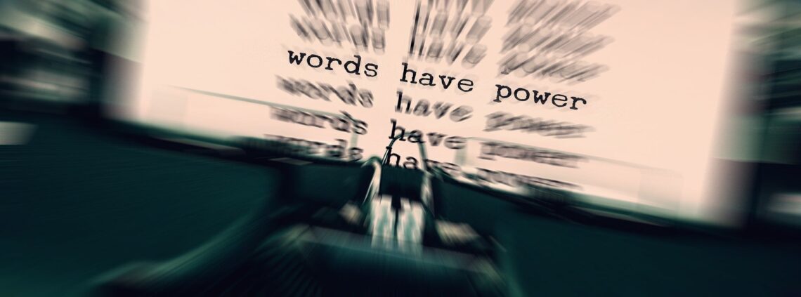 books: A picture of a type writer with the focus on text that reads words have power.
